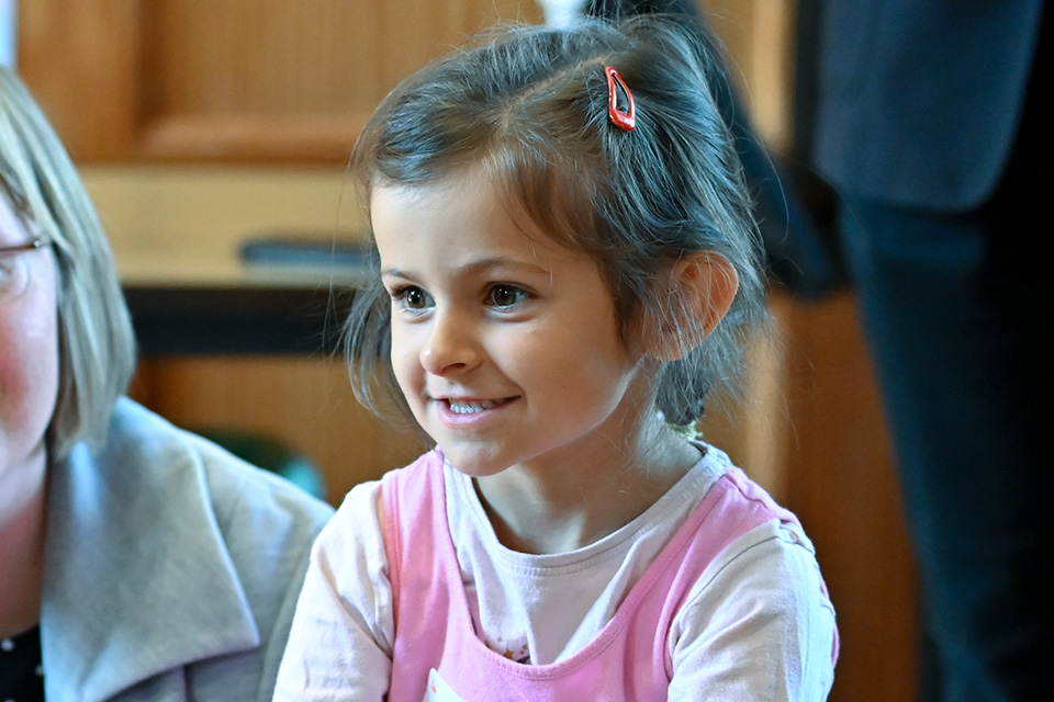 A young girl smiling