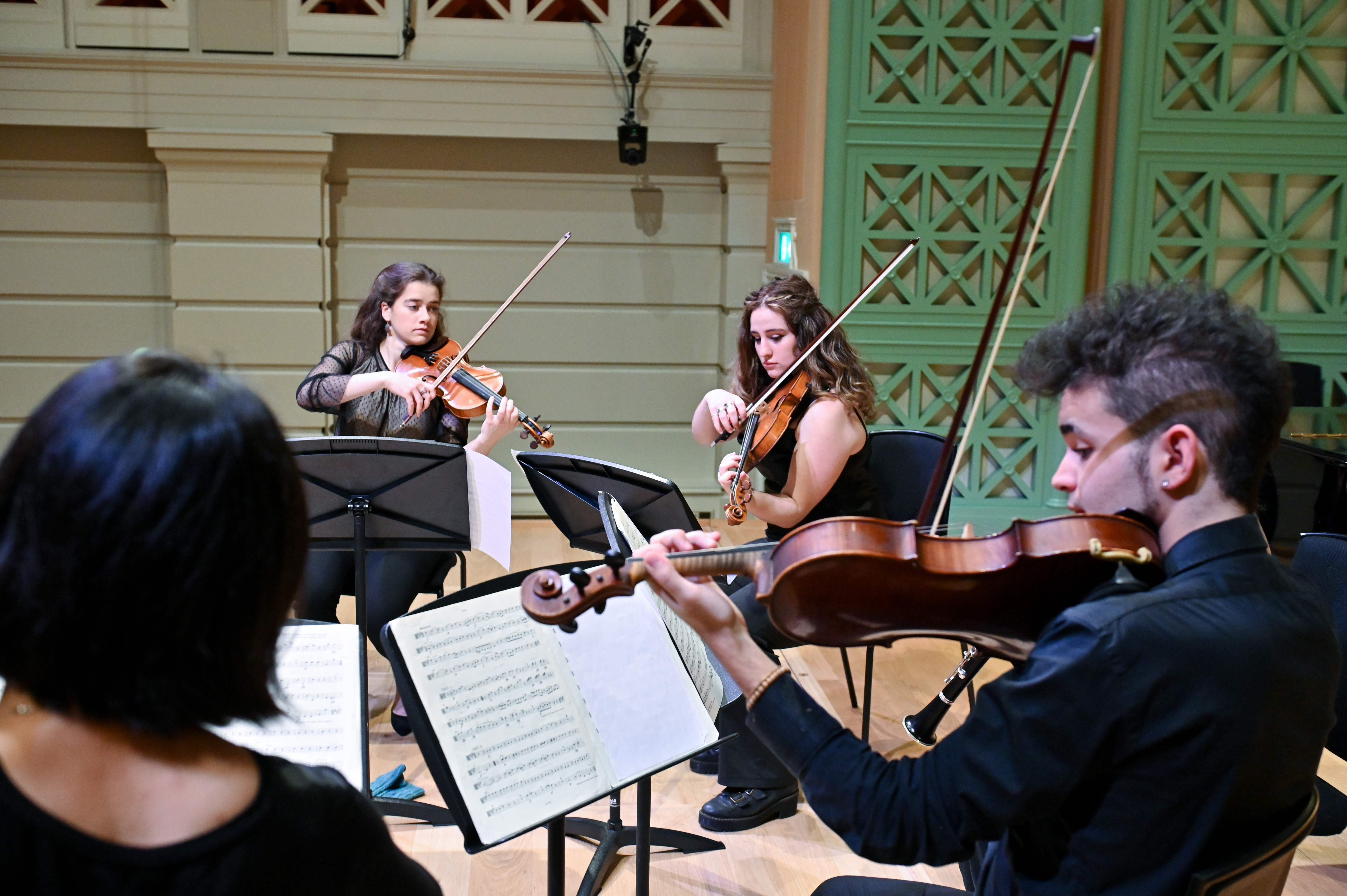 Violinists playing chamber music in the Peformance Hall