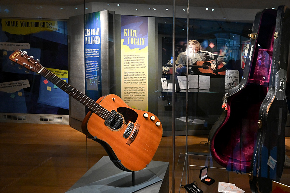 Kurt Cobain's Martin guitar in a display case in the RCM Museum