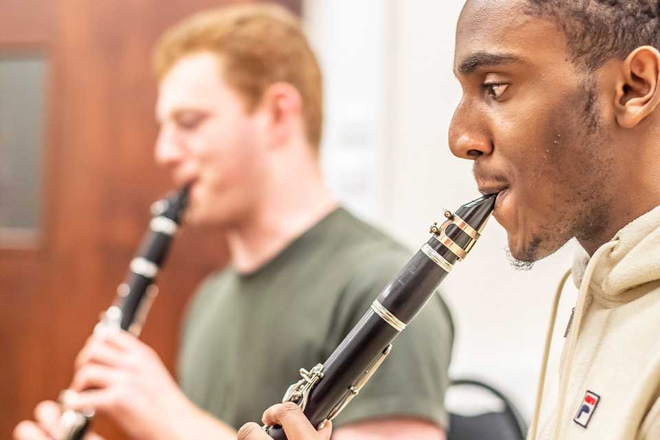 Two clarinetists play their instruments