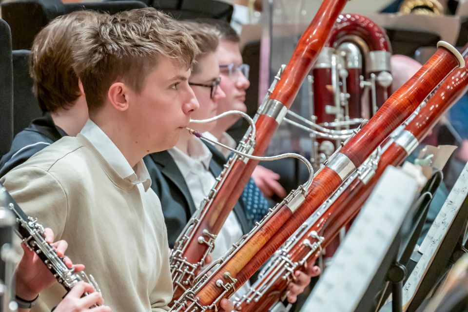 A bassonists plays his instrument on stage