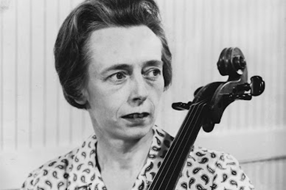 Joan Dickson plays the cello in a black and white image