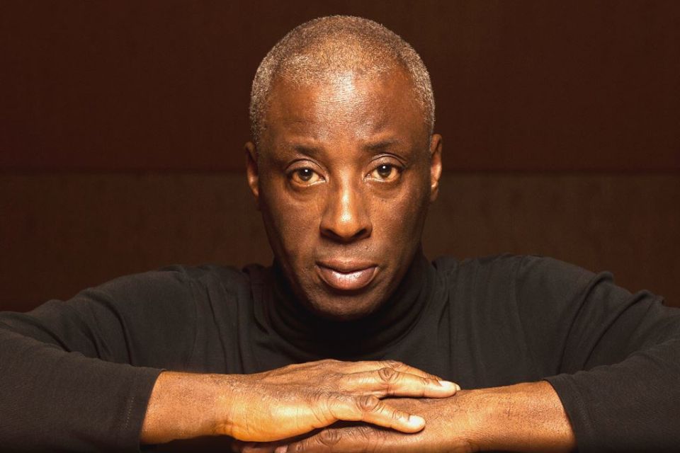 Musician Wayne Marshall wears black and looks to camera