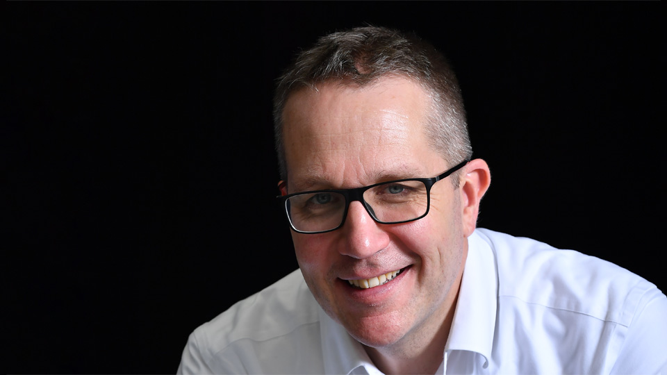 Headshot for Amos Miller