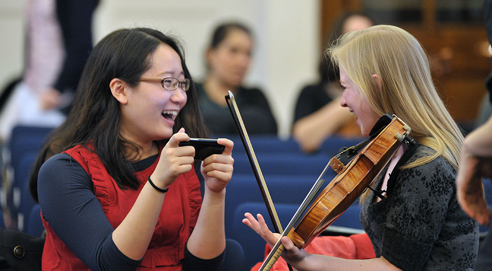 Students laughing in the Amaryllis Fleming Concert Hall
